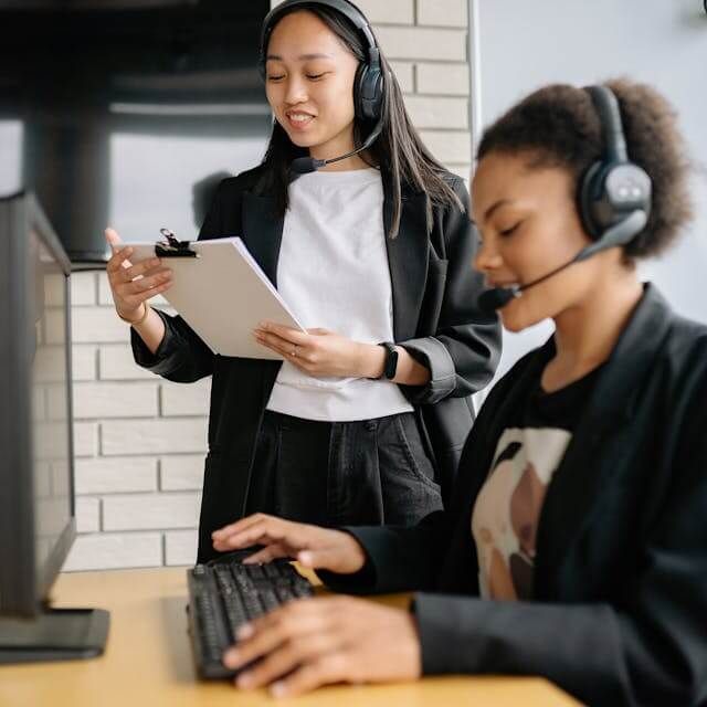 Photo by Yan Krukau: https://www.pexels.com/photo/a-woman-standing-beside-an-agent-looking-at-a-clipboard-8867475/